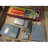 A box containing lighters and cigerette boxes,