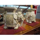 A pair of ceramic elephant form jardiniere stands