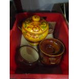 A slipware lidded twin handled pot with verse and two other lidded storage containers (3)