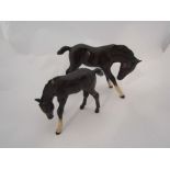 A large Beswick Foal in brown gloss, head down,