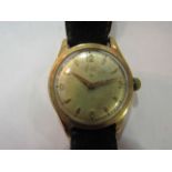 A 9ct gold "Avia Deluxe" gentleman's wristwatch with leather strap