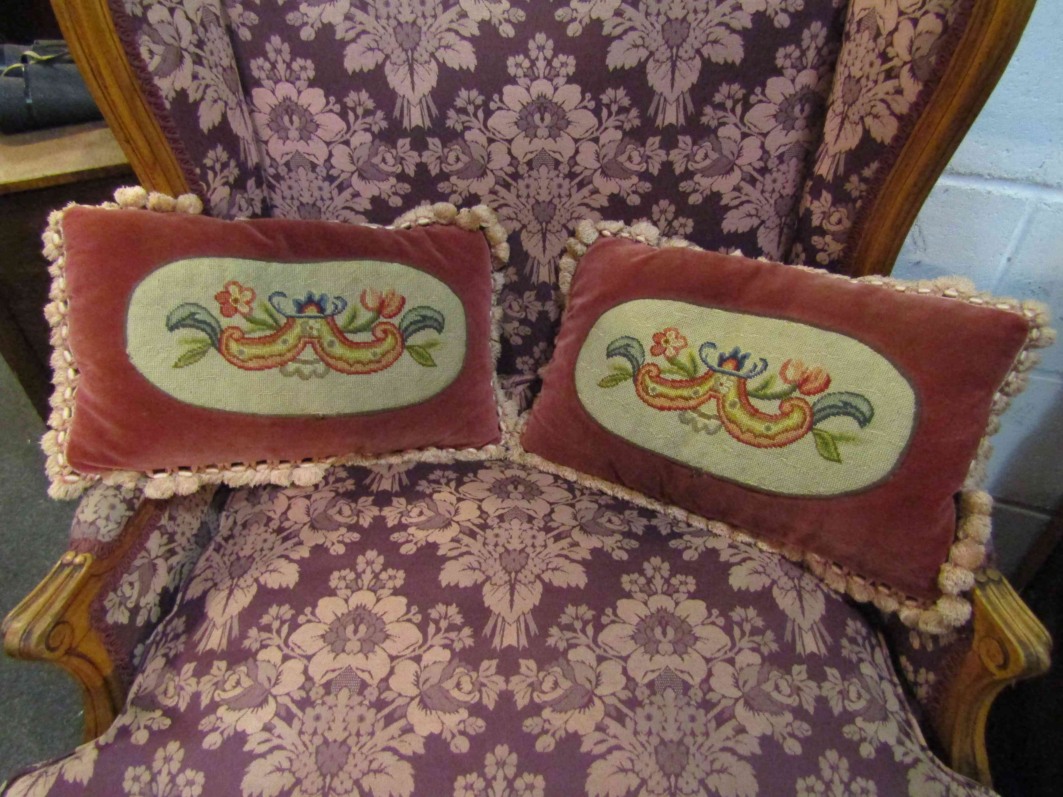Two velvet cushions with needlepoint panels and toning fringing