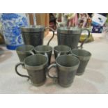 A quantity of Mullingar pewter consisting of two tankards and six small cups (8)