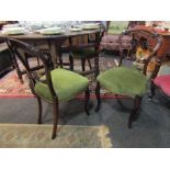 A set of four Victorian walnut balloon back dining chairs, sprung stuffed serpenetine front seats,