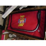 A Queen Diamond Jubilee picnic and concert wicker basket and bag with contents toincluding poncho,