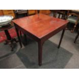 A mahogany tea table with arched supports,