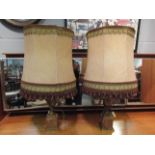 A pair of onyx lamps with shades