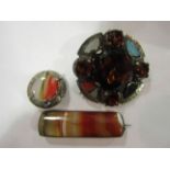 Two hardstone brooches and an agate brooch