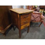 An oak bedside table with pull out tray and three drawers,