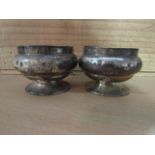 A pair of silver salts with blue glass liners