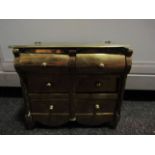 A Georgian brass miniature chest of drawers