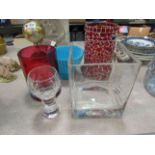 A modern glass vase, candle holders,