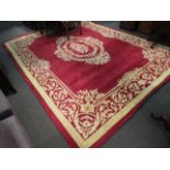A red and gold ground rug, 370cm x 272cm,