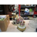 A Capodimonte style figural group of homeless man with bag, associated gilt metal base,