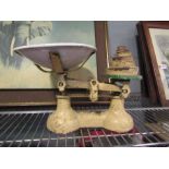 A set of vintage weighing scales with weights