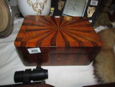 A rosewood and satinwood sunburst design box.