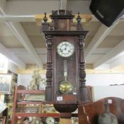 A mahogany wall clock.