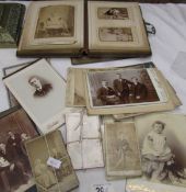 A Victorian photograph album and loose photographs.
