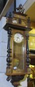 A Vienna wall clock with spring mechanism.