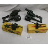 2 diecast desk top signalling cannons (one with cartridge) and 2 boxed Dinky 6928693 Howitzer