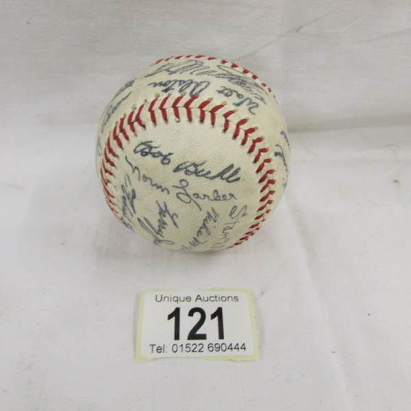 An old baseball from the USA bearing various signatures.