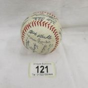 An old baseball from the USA bearing various signatures.