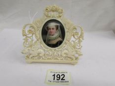 A 19th century miniature portrait of a lady in an ornate ivory frame (frame a/f),