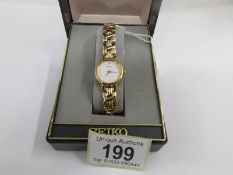 A boxed unused Seiko wrist watch.