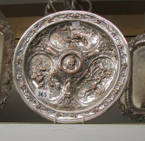 An Elkington style silver platter on copper tray.