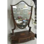 A Victorian mahogany shield shaped toilet mirror on drawer base with shell inlay.