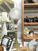 A Victorian brass column oil lamp with cut glass font, Sherwood's burner and acid etched shade.