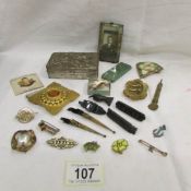 A mixed lot including name brooch, badges, black brooches etc.