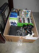 A quantity of Xbox 360 games, an Xbox 360 with hardware and an Xbox 360 Scene It.