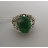 A 3.5 carat oval emerald and 88 point baguette and brilliant diamond high carat white gold ring,