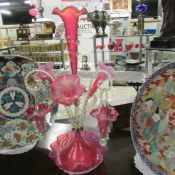 A cranberry glass epergne.