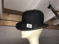 An Ace Brand bowler hat, size 6 & 7/8.