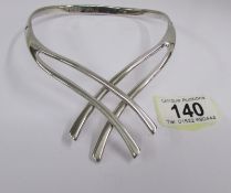 A Miquel Pineda silver collar necklet in a cross over design of heavy quality, signed.