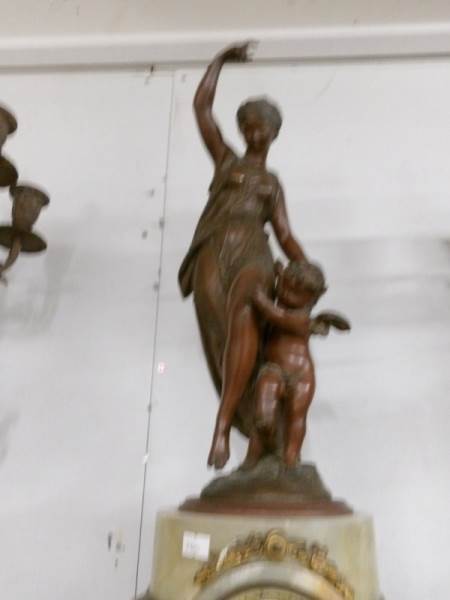 A 3 piece clock garniture comprising clock surmounted mother with child and pair of candelabra. - Image 3 of 4