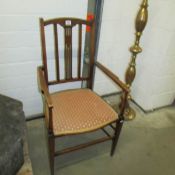 An Edwardian inlaid elbow chair.