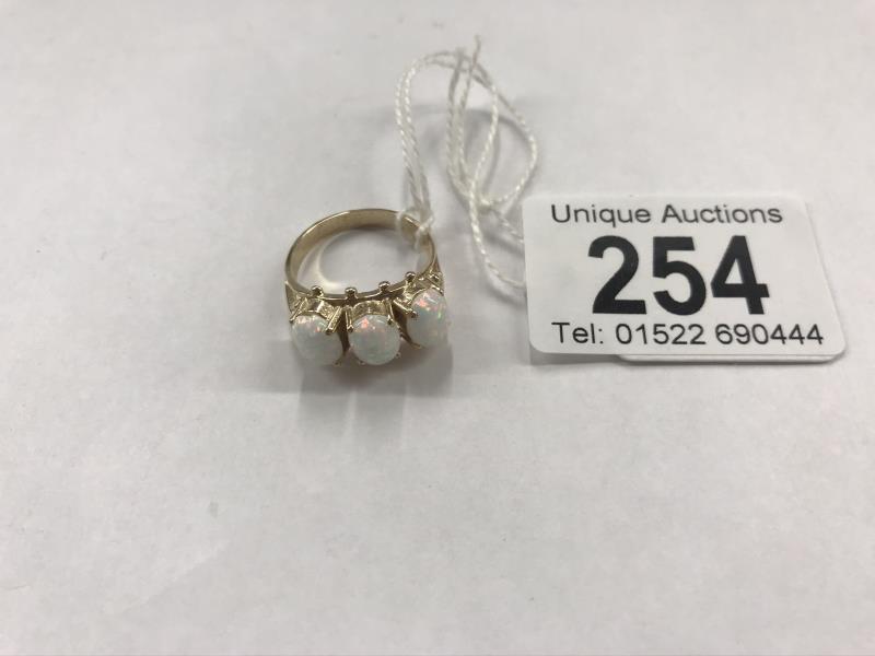 A 9ct gold ring set 3 large opals, size O. - Image 3 of 5