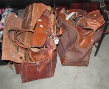 A quantity of vintage holdalls, etc., including leather.