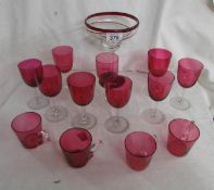 9 cranberry wine glasses, 4 cranberry beakers and a TGI Friday's cocktail glass.