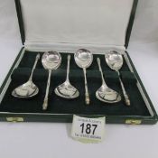 A superb cased set of silver spoons.