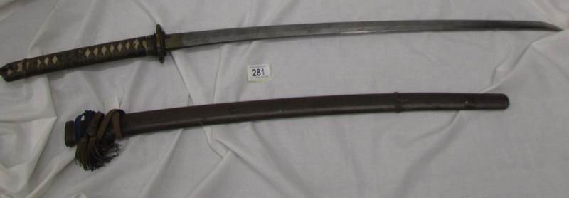 A 19th century Japanese sword in sheath.