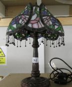 A table lamp with Tiffany style shade.
