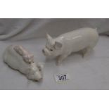 A Beswick sow with piglet on its back and a Beswick boar.