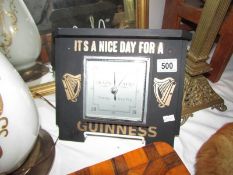 A Guinness barometer.