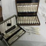 A good quality cased set of 12 fish knives and forks together with 8 other knives and forks.