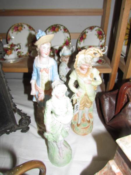 4 continental bisque porcelain figures.