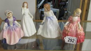 4 Royal Doulton figurines - Joy HN3875, Dinky Doo HN1768, Andrea HN 3058 and Rose HN 7358.